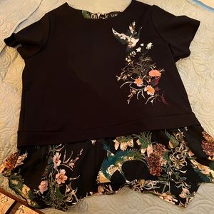 Black embroidered sweatshirt with peplum